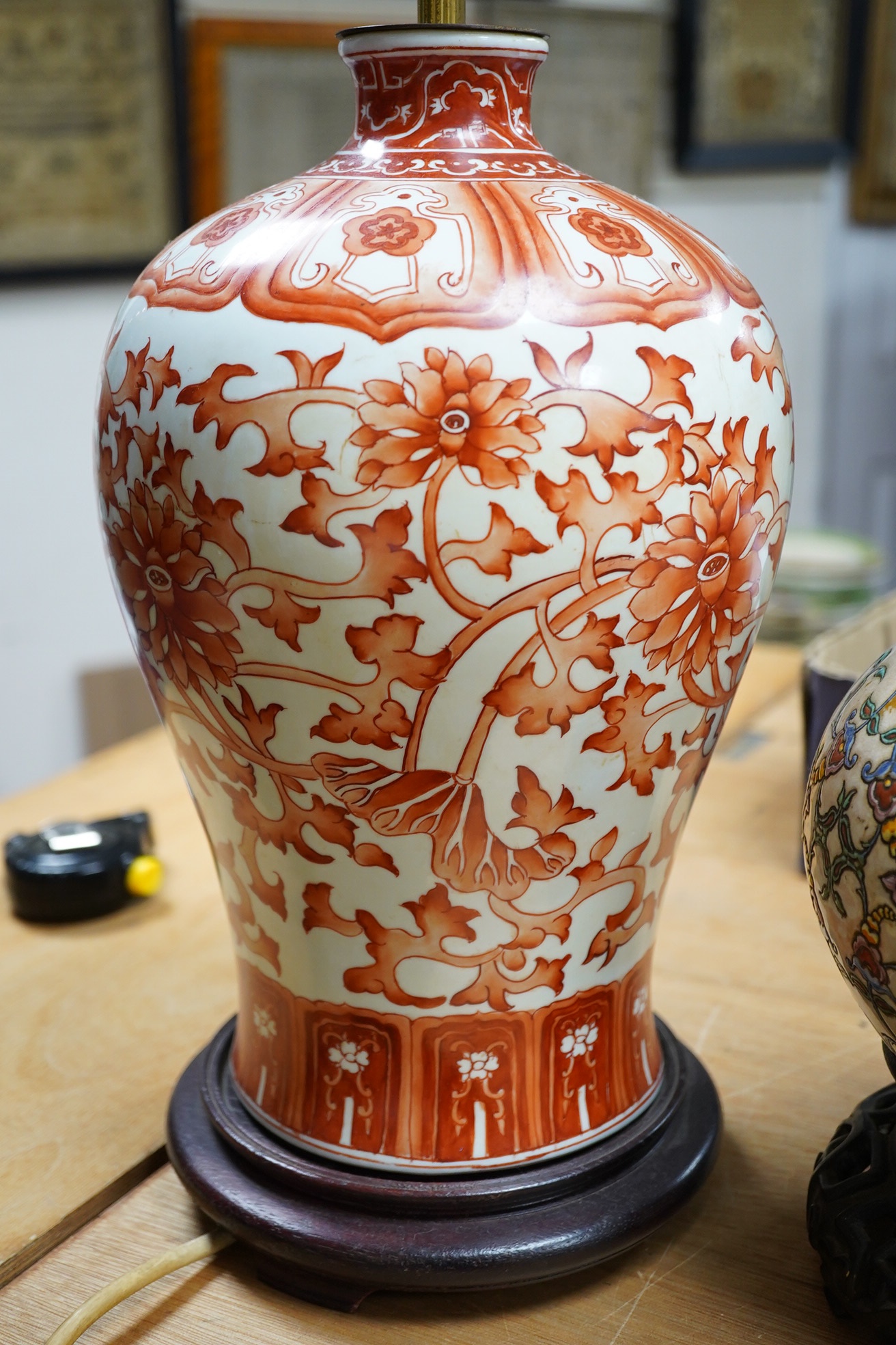 A Chinese vase lamp, polychrome decorated in relief and other, baluster Ming style lamp in iron red, largest overall 9cm high (2). Condition - one good, one broken and repaired